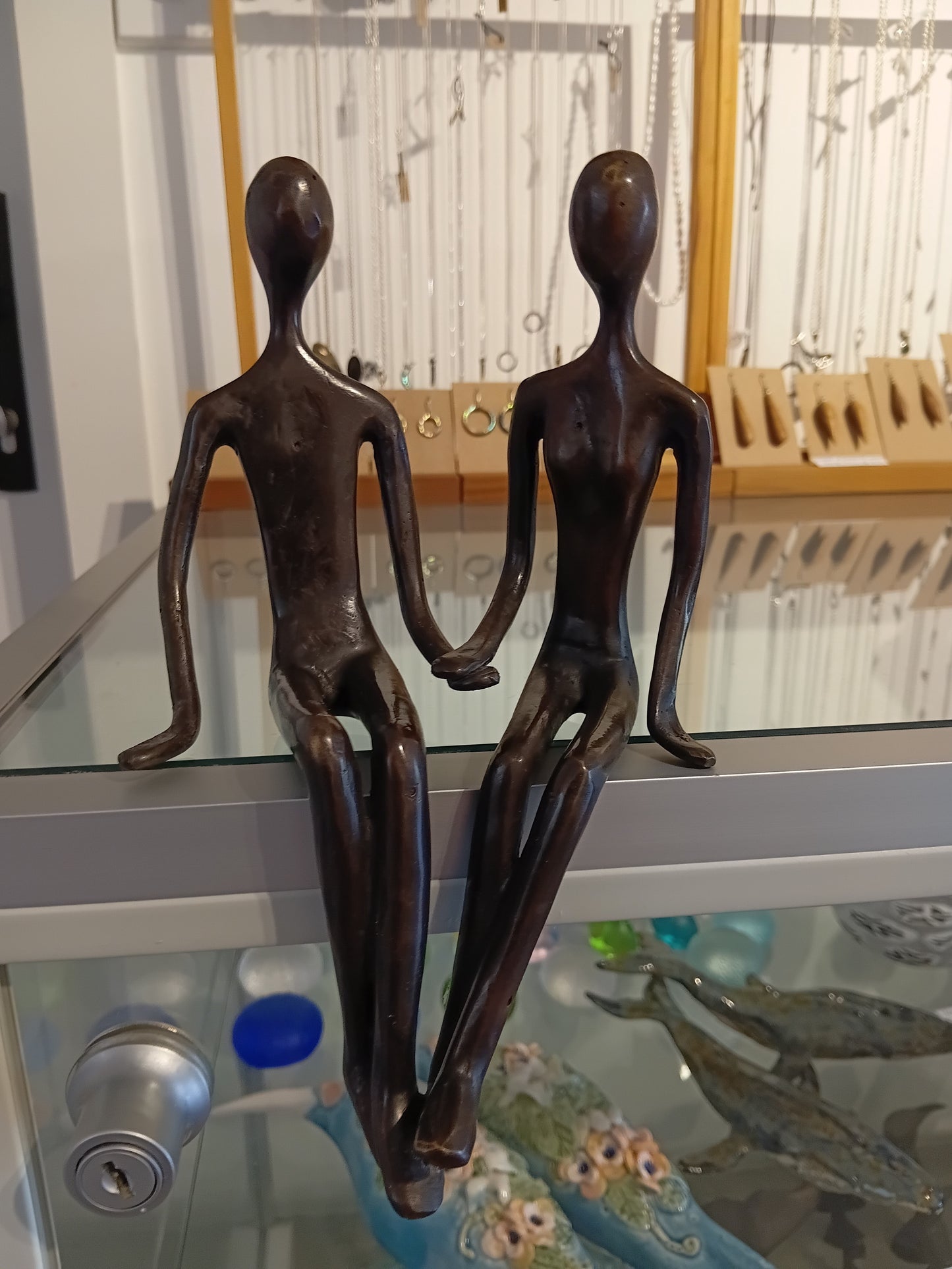 Brass sitting couple