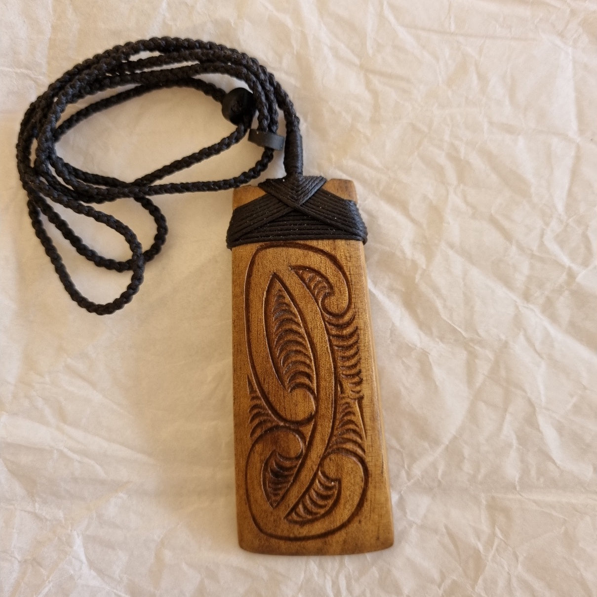 Hei Toki. Adze. Coromandel Kauri. 4 plait. Basalt toggle. Kowhaiwhai pattern.
