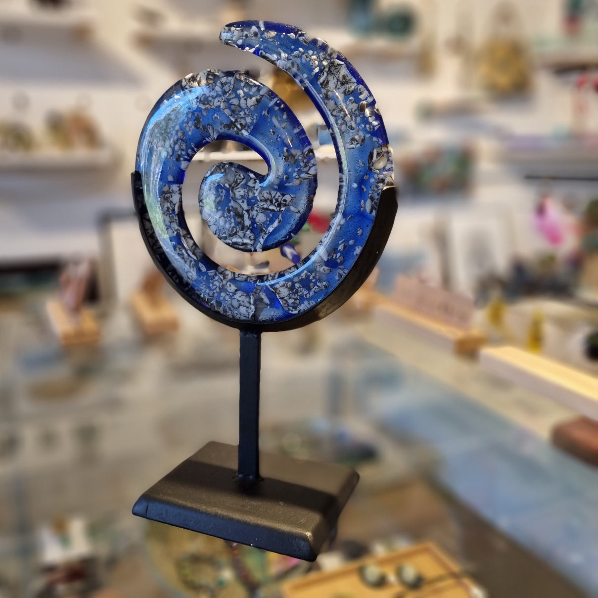 River Rocks Koru in metal stand