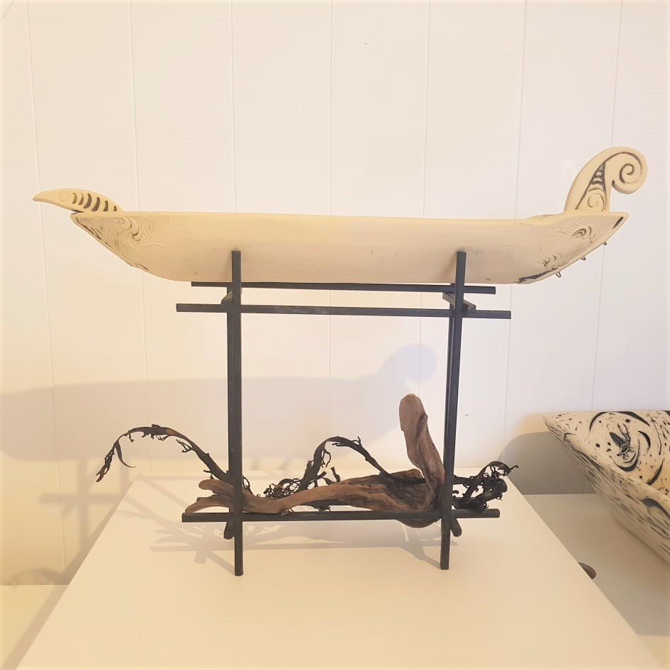 Waka on metal stand