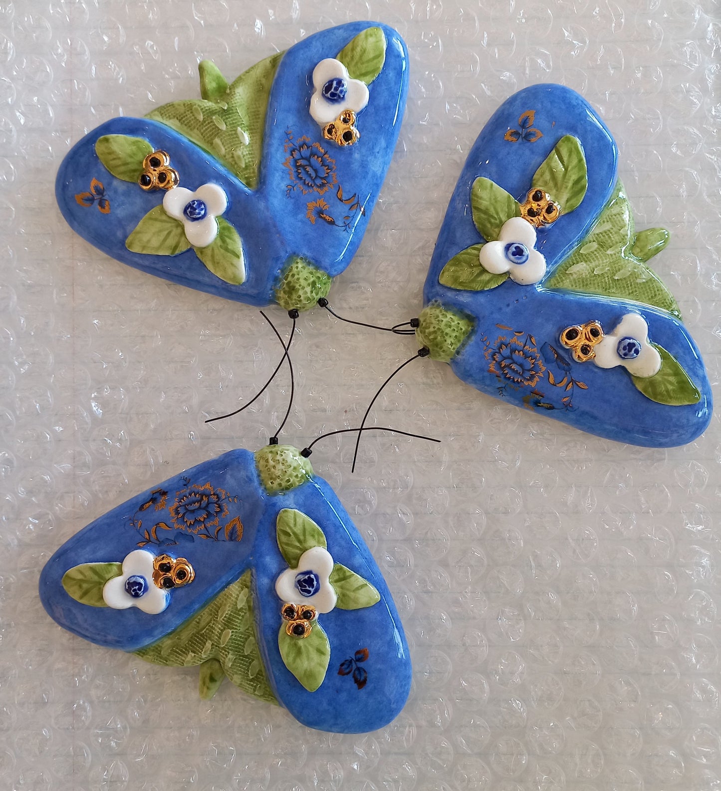 Dark Blue Moth with gold