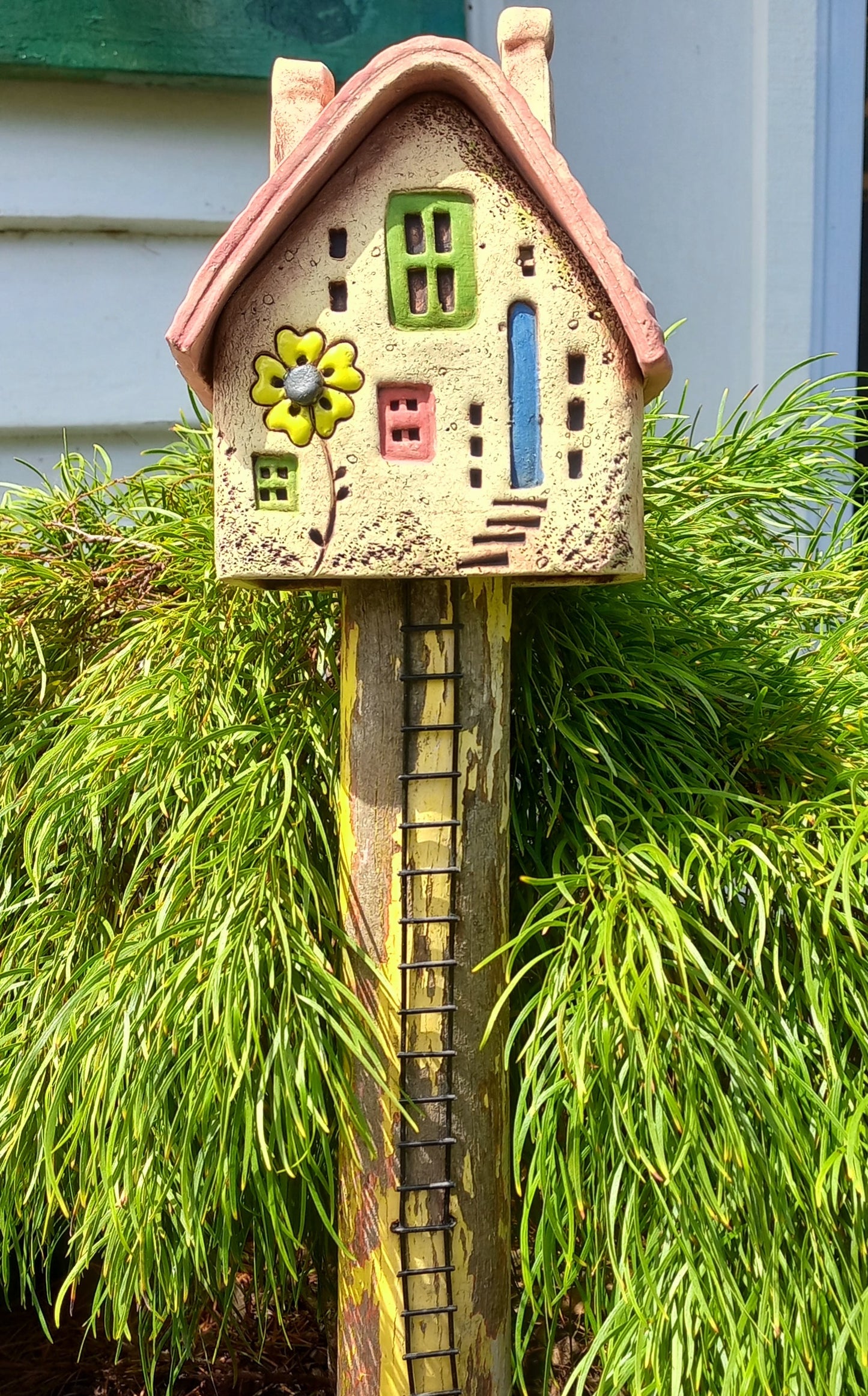 Clay House with Ladder on Wood