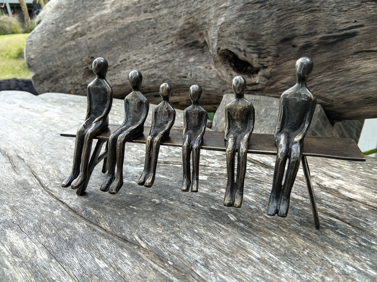 Brass family 6 on bench