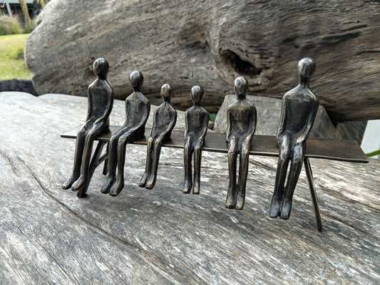 Brass family 6 on bench