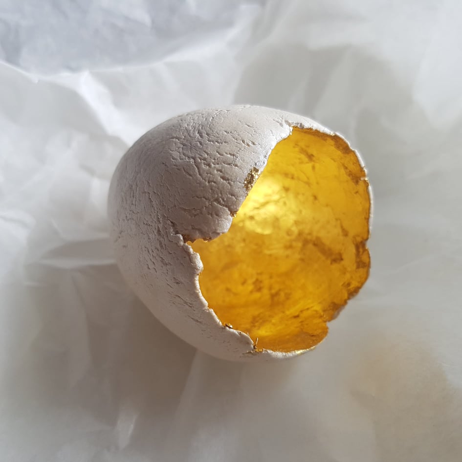 Large ceramic egg with gold foil inside